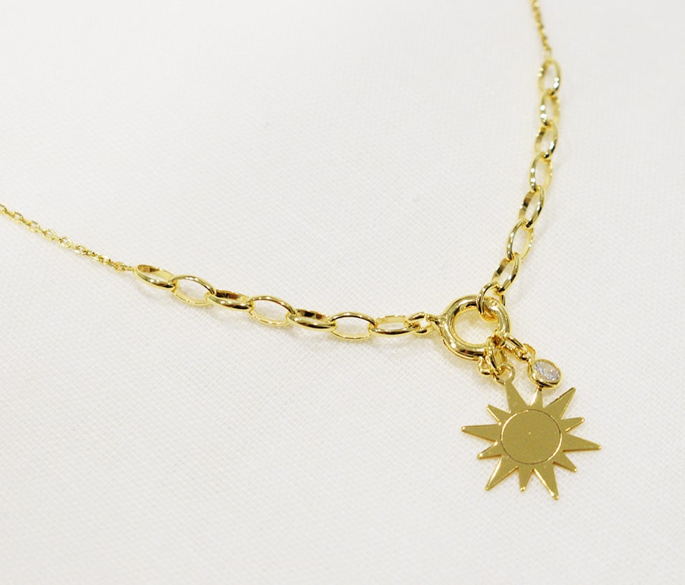 Collana Sole con punto luce di zircone in argento 825 placcata oro.
