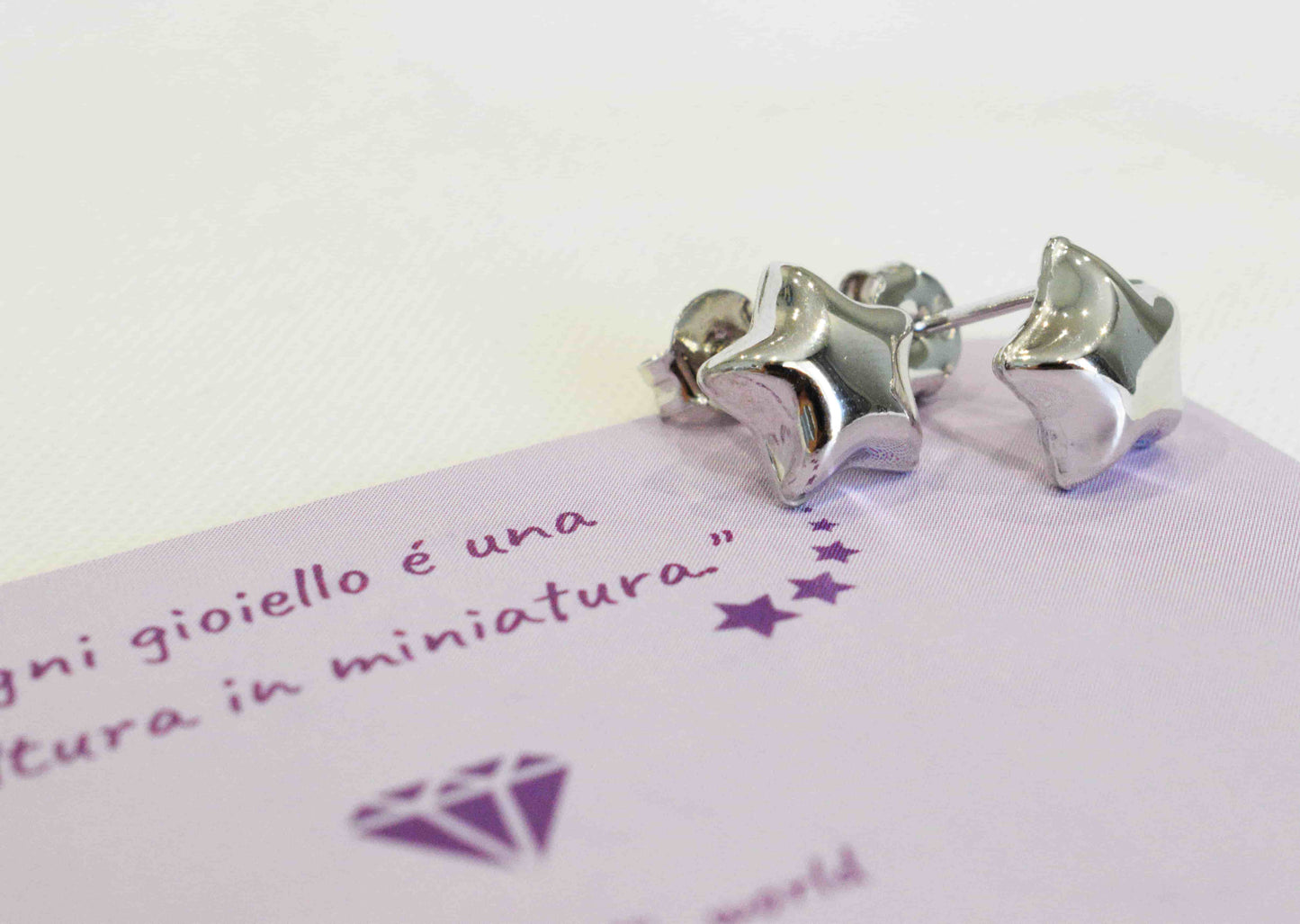 Coppia orecchini stella bombata in argento 925