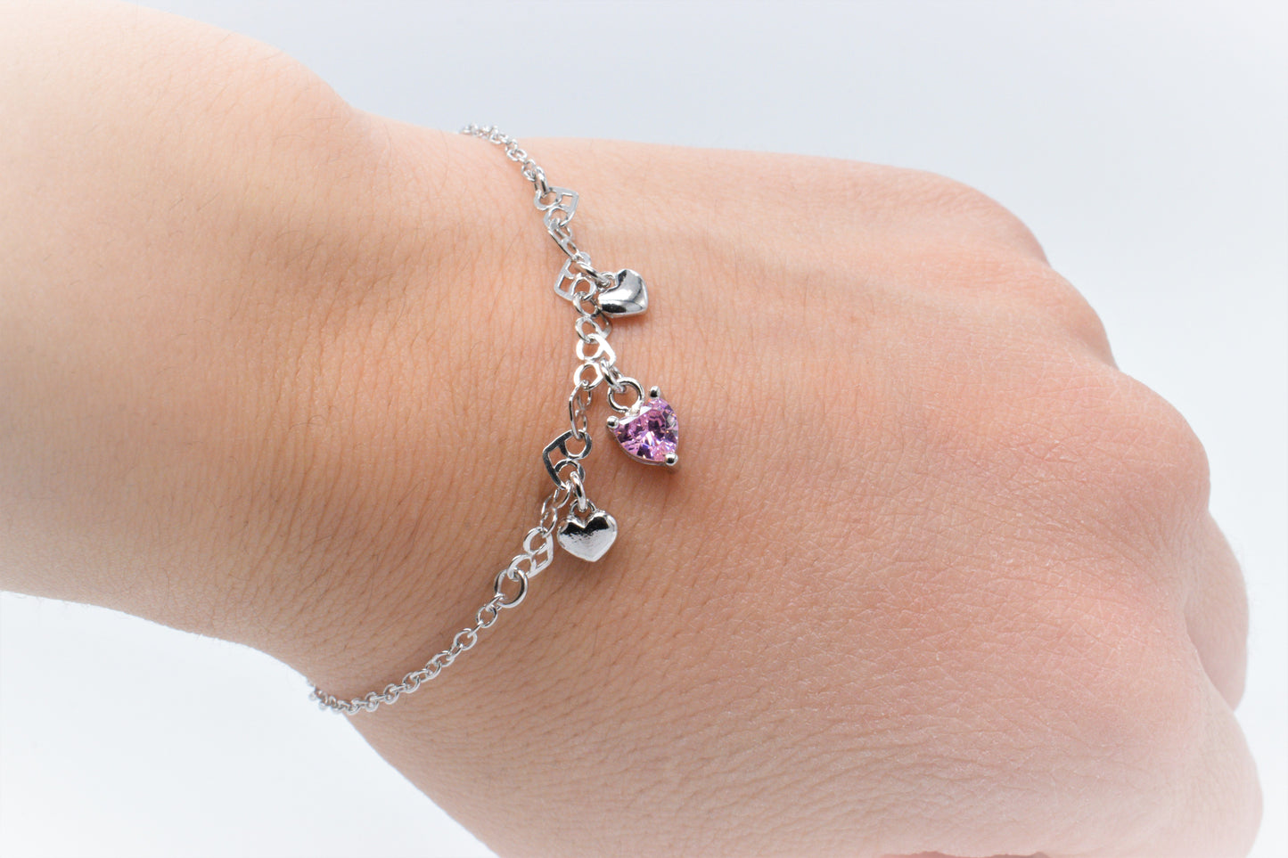 Bracciale MultiCuore rosa indossato
