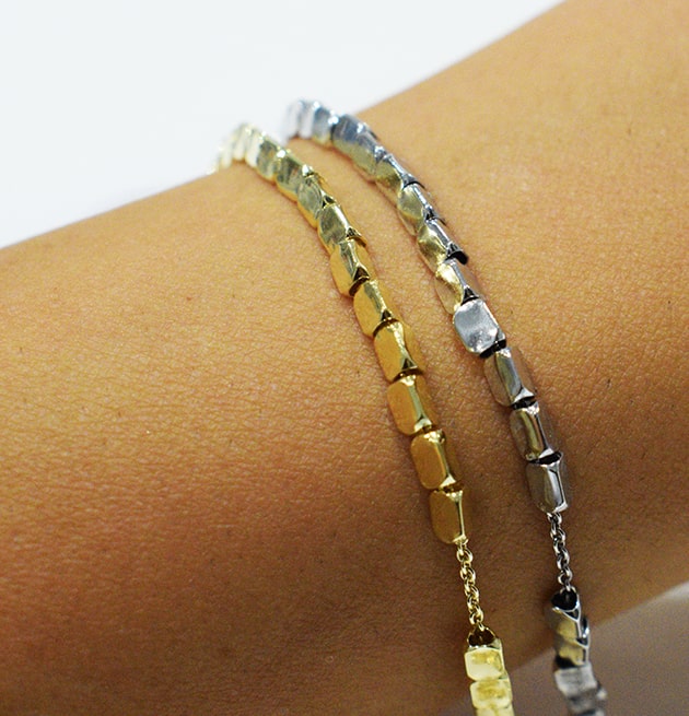 Bracciale Move indossato colorazione argento o placcato oro.