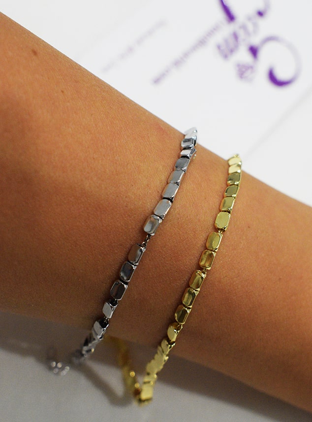 Bracciale Move indossato colorazione argento o placcato oro.