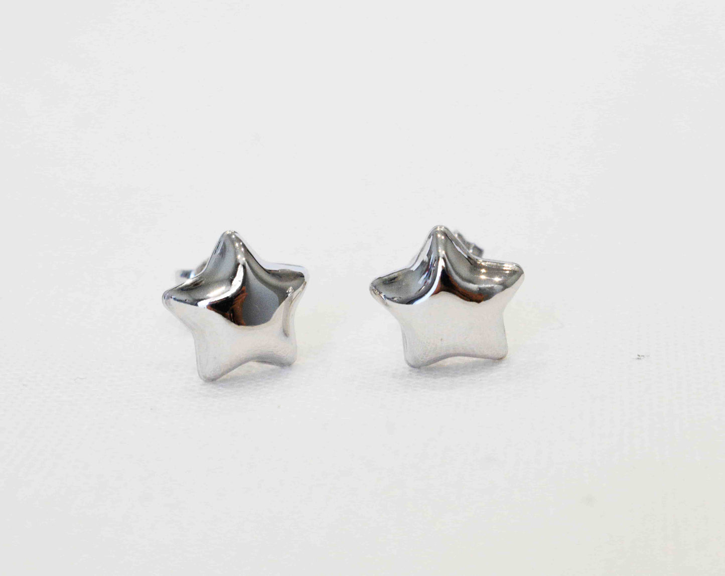 Coppia orecchini stella bombata in argento 925 colorazione argento