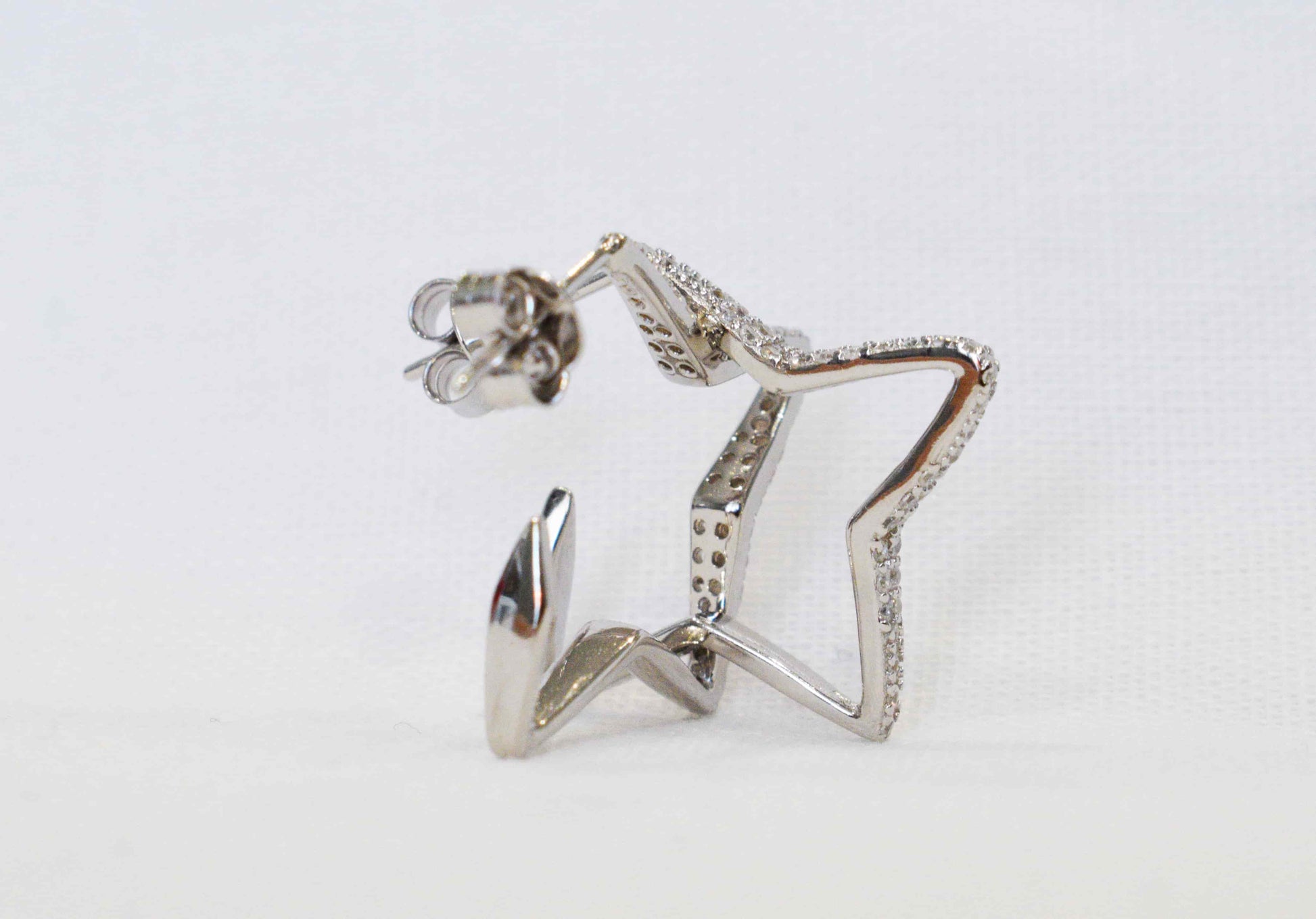 Coppia orecchini stella in argento 925 e zirconi.
